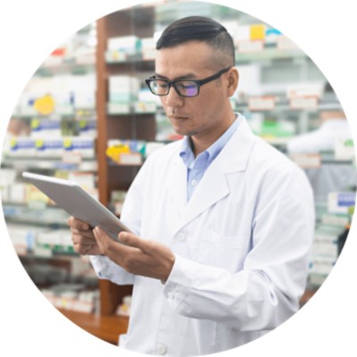 Exchange Dx - male pharmacist looking at tablet