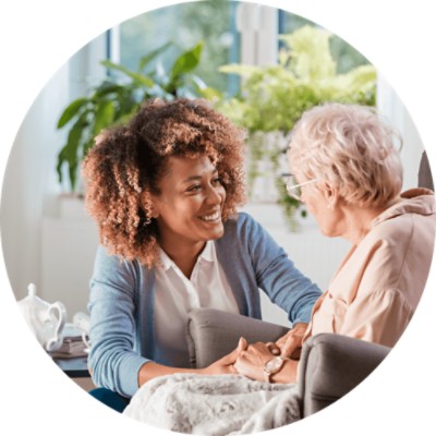 Community Connector - Young woman helping elderly woman