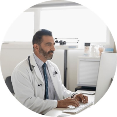 CareSelect - Doctor looking at computer screen