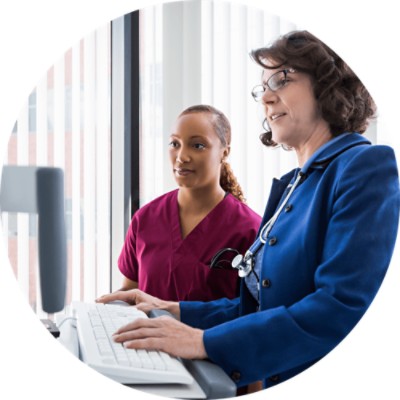 Two Woman looking at computer screen