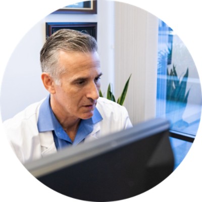 Male doctor working at desk