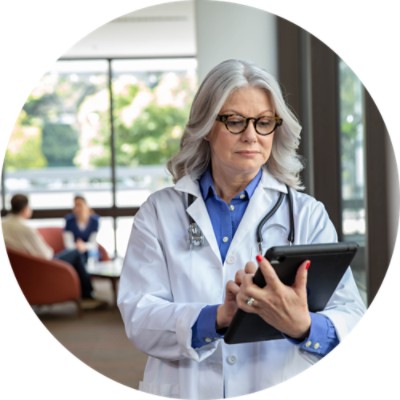 Woman doctor using tablet