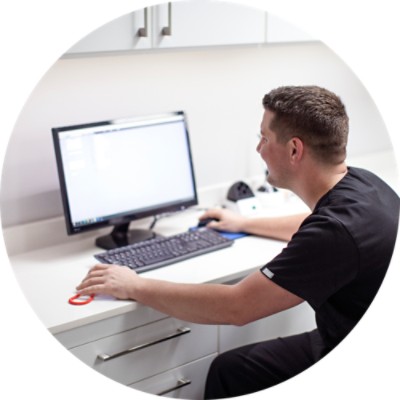 Man sitting at desk working on a computer