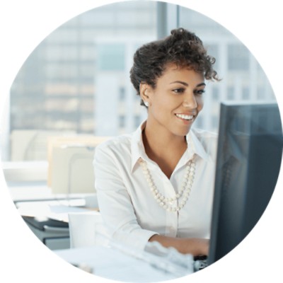 Connected Authorization Services - businesswoman working at computer