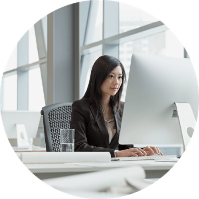 Inventory Management - businesswoman working at office computer