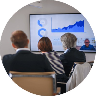 Diverse executive team video conferencing with CEO and discussing data