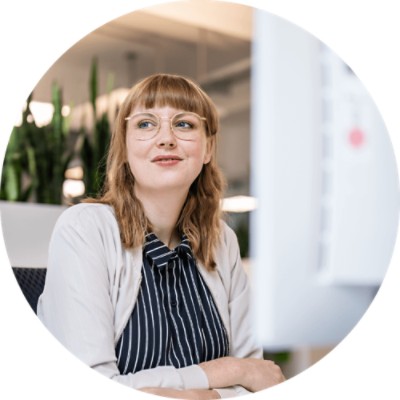 Predictive Engagement - businesswoman looking out the window while at work