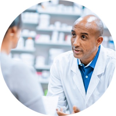 Pharmacy Management Software Solutions - pharmacist in discussion with patient