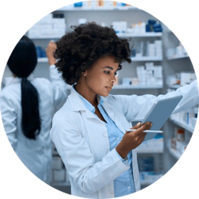 Pharmacy Management Software Solutions - pharmacist looking at tablet