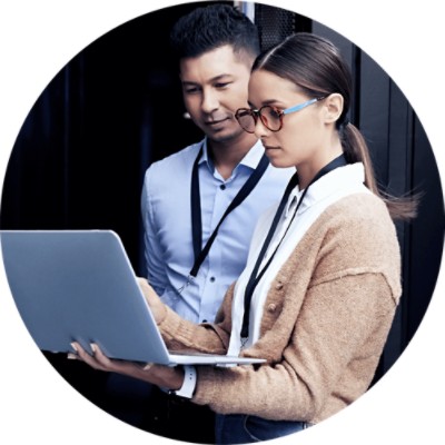 Hosted Storage - two colleagues looking at laptop while standing