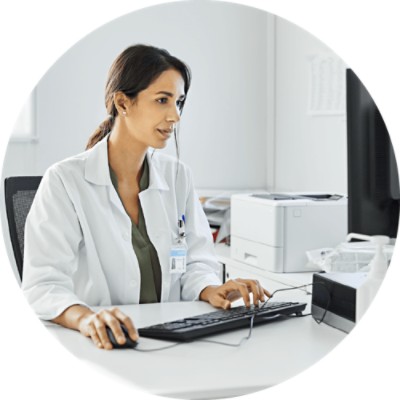 Predictive Engagement - doctor working at computer
