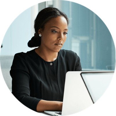 Risk View - businesswoman focused on computer