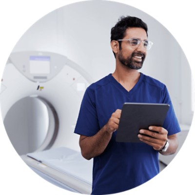 Radiology Practice RCM - radiology tech holding tablet