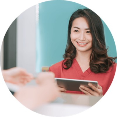 Financial Counseling - healthcare worker smiling at patient