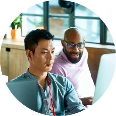 Two men looking at computer