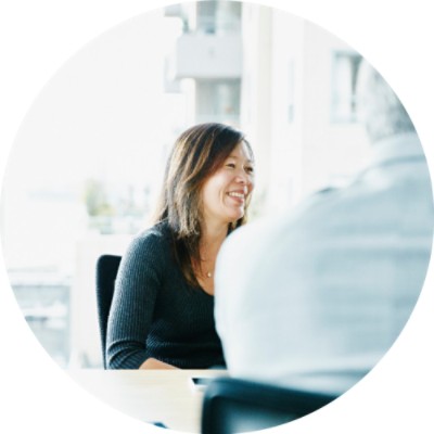 Woman smiling in board room