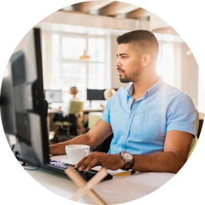 Man sitting at desk working on a computer