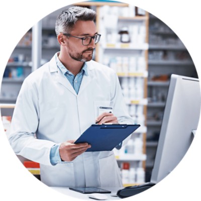 Pharmacist writing on clipboard