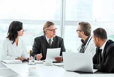 Businessmen and doctors having a meeting.   Taken at iStockalypse Berlin.